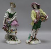 A pair of Continental figures of harvesters height 23cm