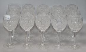 A quantity of mixed cut glass wine glasses height 17cm