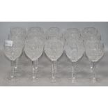 A quantity of mixed cut glass wine glasses height 17cm