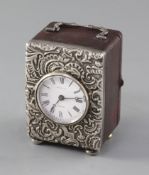 A late Victorian repousse silver mounted carriage timepiece, retailed by Harris, Bath, with French