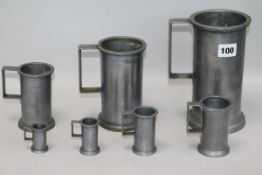 A set of seven French graduated pewter measures tallest 19cm