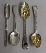 A George II silver marrow scoop, London 1740, a pair of silver berry spoons (later embossed) and a