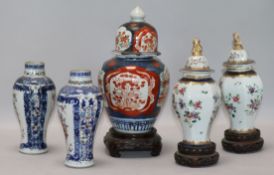 A pair of Chinese famille rose vases, a pair Samson vases and cover, and an Imari vase and cover