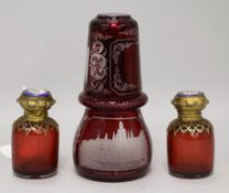 A pair of ruby glass scent bottles, a Bohemian ruby glass flask and a beaker (4) scent bottles