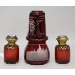 A pair of ruby glass scent bottles, a Bohemian ruby glass flask and a beaker (4) scent bottles