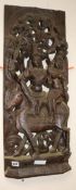 A wooden carved panel of a god and goddess width 31cm height 77cm