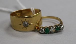 An early 20th century 18ct gold and gypsy set diamond ring and an 18ct gold, emerald and diamond