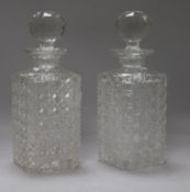 A pair of square cut glass cased decanters