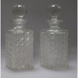 A pair of square cut glass cased decanters