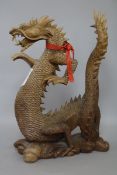 A 20th century carved wood Chinese dragon width 24cm height 36cm