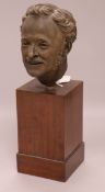 A mid 19th century terracotta head of a man, on stand overall height 29cm