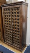 An Indian carved hardwood cupboard W.99cm