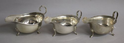 A pair of 1950's silver sauceboats and an earlier silver sauceboat. 9.5 oz.