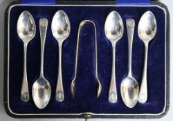 A cased set of six George V silver coffee spoons and tongs.