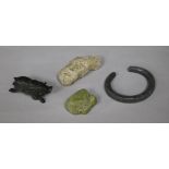 A collection of miscellaneous curios, including a coprolite specimen, a Celtic style iron torch with