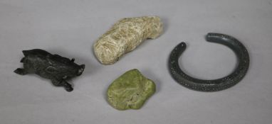 A collection of miscellaneous curios, including a coprolite specimen, a Celtic style iron torch with