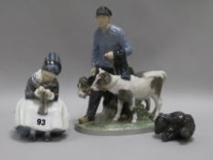 Three Royal Copenhagen figures to include Farmer and two calves, seated girl and a small bear