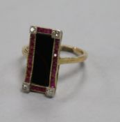 An Austro-Hungarian yellow metal, black onyx, ruby and diamond set tablet ring, size K.