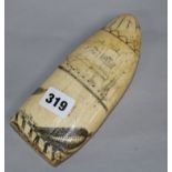 An early 19th century Scrimshaw whale tooth length 18cm