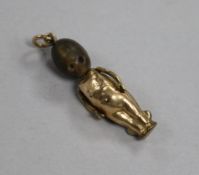 An early 20th century gold plated "Fums Up" charm, 32mm.