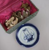 A 19th century Chinese blue and white plate and eight stoneware figures plate diameter 19cm