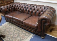 A leather Chesterfield sofa W.209cm
