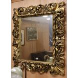 A gilt scroll frame wall mirror W.90cm