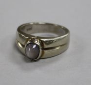 A heavy 18ct white gold dress ring set with a cabochon star sapphire?, size S, 10g gross