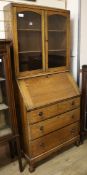 A 1920's oak bureau bookcase W.74cm