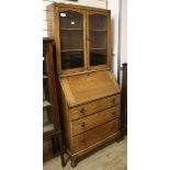 A 1920's oak bureau bookcase W.74cm