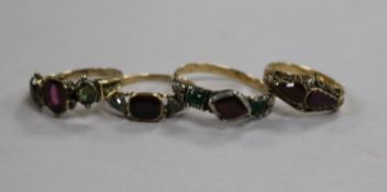 Four Georgian yellow and white metal rings, variously-set with gems and seed pearls in carved mounts