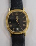 A gentleman's gold plated and steel Omega De Ville automatic wrist watch.