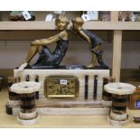 A French Art Deco marble and alabaster clock garniture with figural surmount width 58cm height 51cm