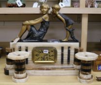 A French Art Deco marble and alabaster clock garniture with figural surmount width 58cm height 51cm