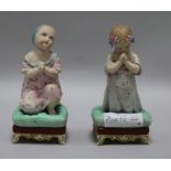 A pair of bisque figures of praying children height 16cm