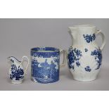 An 18th century Caughley cabbage leaf jug, a Worcester cream jug and a blue and white mug tallest