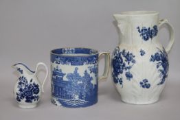 An 18th century Caughley cabbage leaf jug, a Worcester cream jug and a blue and white mug tallest