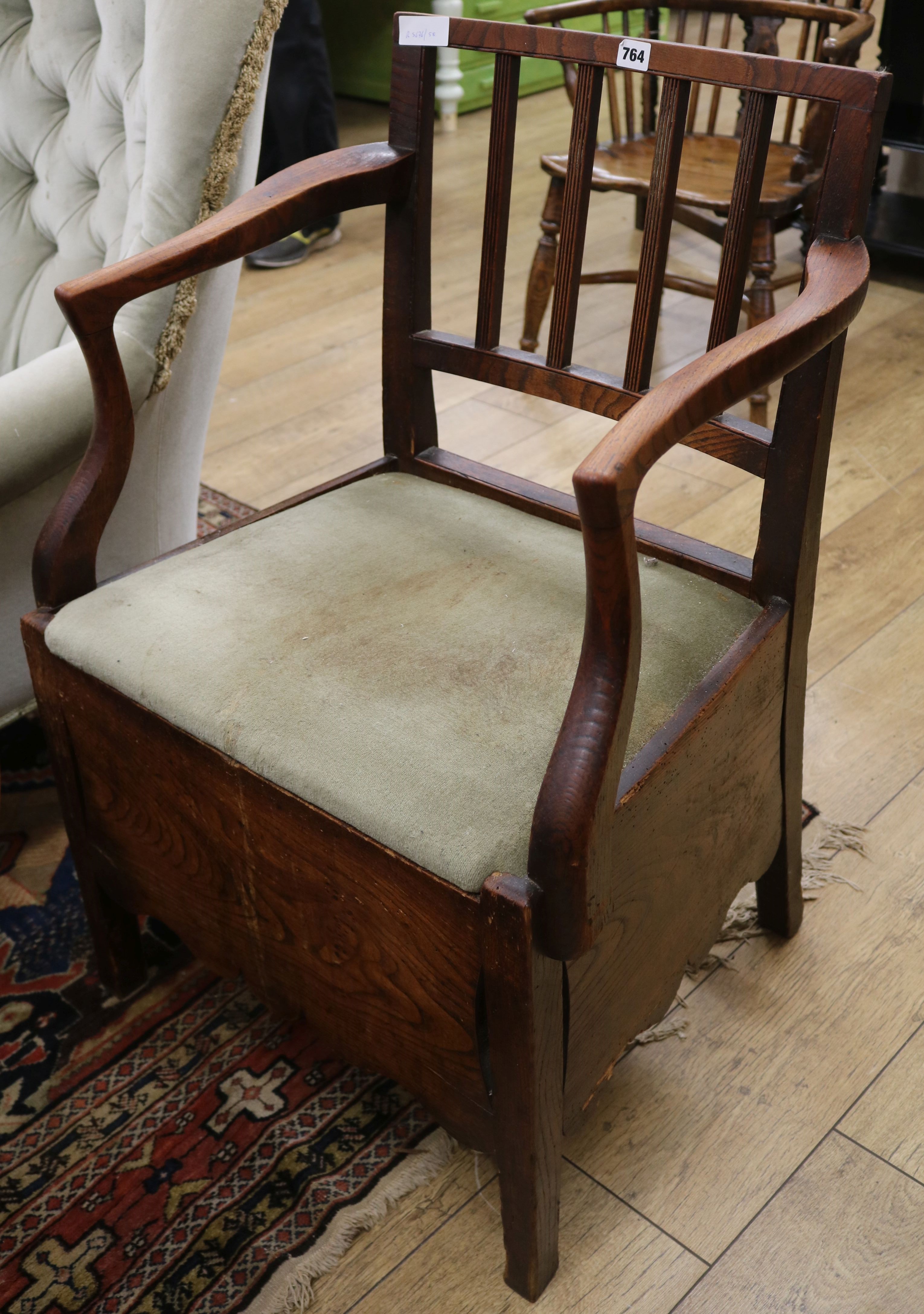A Regency elm commode chair