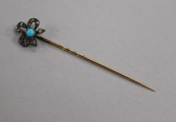 A Victorian rose-cut diamond and turquoise stick pin with tied-ribbon terminal
