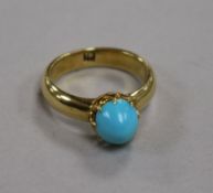 An 18ct gold and turquoise cabochon ring, 6.8g, size O.