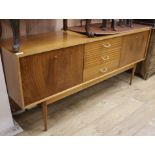 A mid century teak sideboard W.183cm