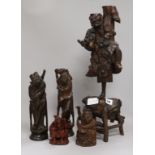A collection of figurative root carvings tallest 55cm