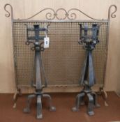 A pair of wrought iron firedogs and firescreen W.85cm