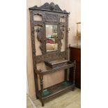 An Edwardian oak hallstand W.96cm