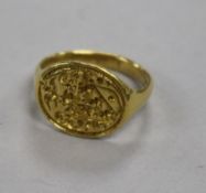 A yellow metal signet ring with shield-carved matrix (tests as 22ct), 9.6g