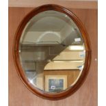 An oval mahogany mirror W.60cm