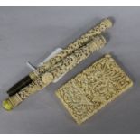 A Chinese ivory carved card case and two parasol handles