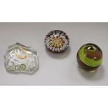 Three paperweights