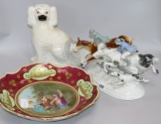 A Sitzendorf hunting group, a Vienna style dish and a Staffordshire spaniel group height 20cm