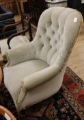 A Victorian buttonback armchair